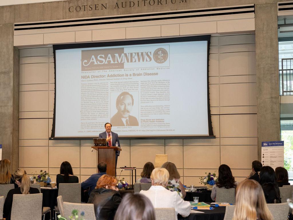 Speaker presenting at a behavioral health conference