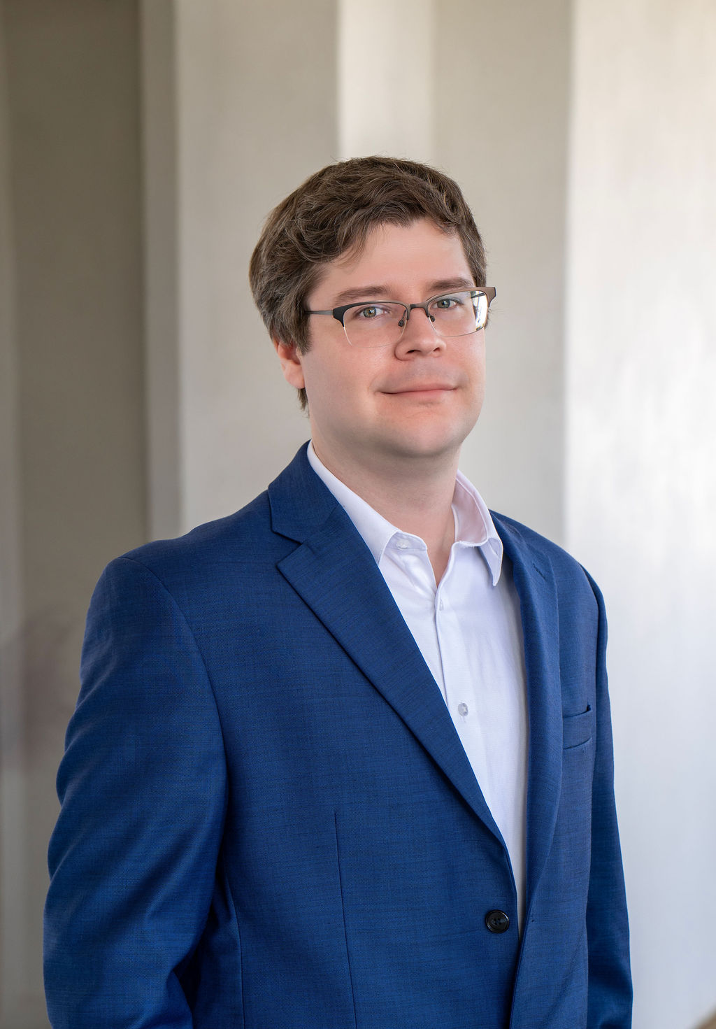 Orange County executive headshot of a man in a blue jacket